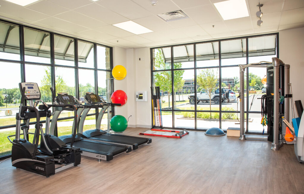 equipments in a gym and there are three color balls and sight of outside gym